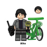 Mike Wheeler custom minifigure, Lego-compatible building block toy with green bike and radio.