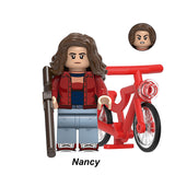 Nancy Wheeler custom minifigure, Lego-compatible toy figure with red bike and shotgun accessory.